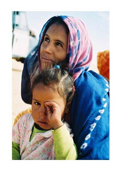 Woman and child on Sahara Desert Tracks Sebkhet Oum way to Bir Moghrein