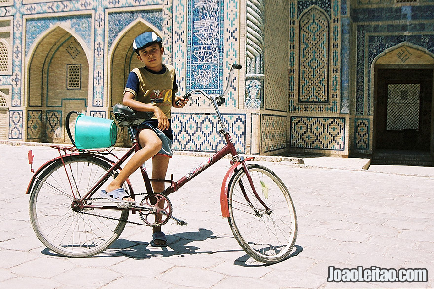 Boy with bicycle in Bukhara, Uzbekistan - Central Asia