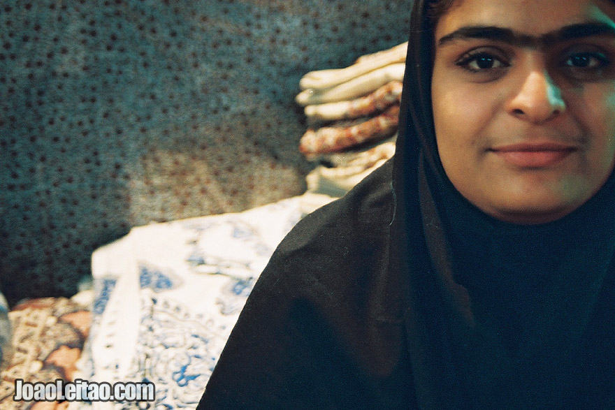 Photo of Girl wearing black chador in Shiraz Market, Iran - Middle East