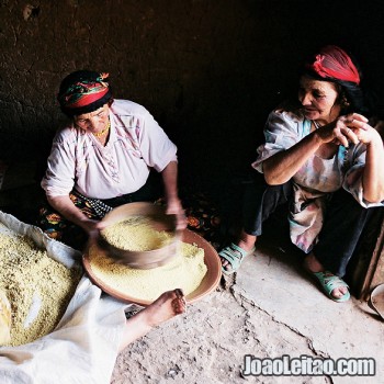 Berber women preparing couscous in Tamtettoucht, Atlas Mountains, Morocco- North Africa