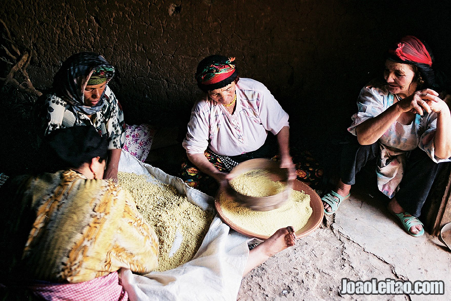 Berber women preparing couscous in Tamtettoucht, Atlas Mountains, Morocco- North Africa