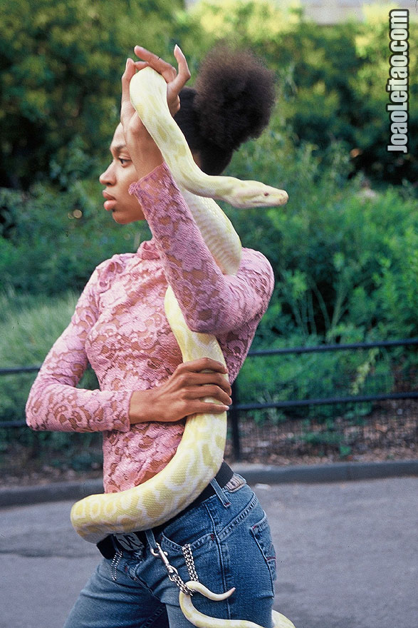 Girl with albino Python in New York City, United States of America - North America
